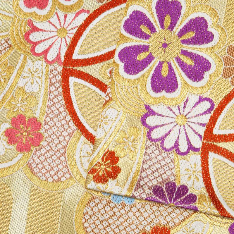 川島織物の六通九寸名古屋帯 紫式部色(赤紫)に金と銀の箔の四角、帯